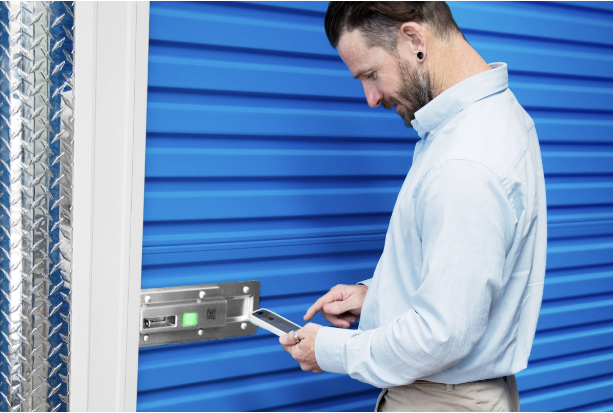 man unlocking storage unit